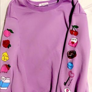 Plain Purple sweatshirt with designs on the sleeves